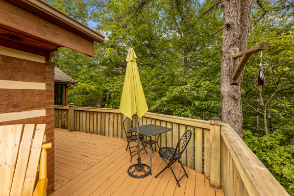 Deck table and chairs for two at Cubs' Crib, a 3 bedroom cabin rental located in Gatlinburg