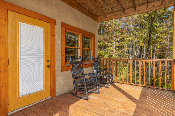 Deck with two rocking chairs at Sensational Views, a 3 bedroom cabin rental located in Gatlinburg