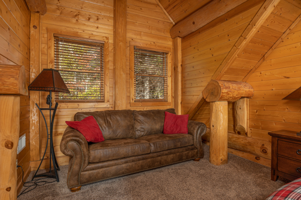 Sofa in a bedroom at Grizzly's Den, a 5 bedroom cabin rental located in Gatlinburg