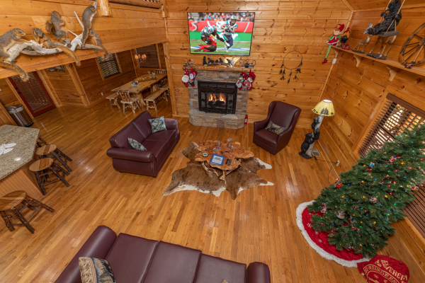 Looking down at the living room at 3 Crazy Cubs, a 5 bedroom cabin rental located in Pigeon Forge