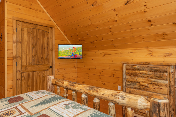 TV and dresser in the loft bedroom at J's Hideaway, a 4 bedroom cabin rental located in Pigeon Forge
