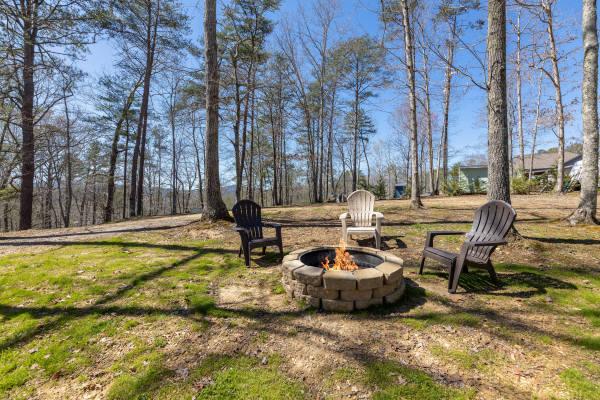 Fire pit at A Mountain Hyde-a Way, a 2 bedroom cabin rental located in Pigeon Forge