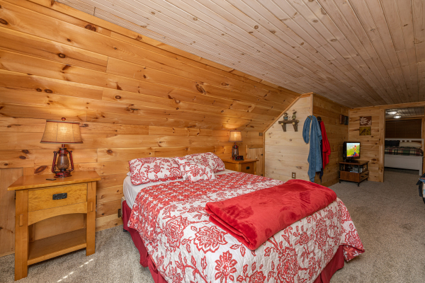 Bedroom with night stands and lamps at A Mountain Hyde-a Way, a 2 bedroom cabin rental located in Pigeon Forge