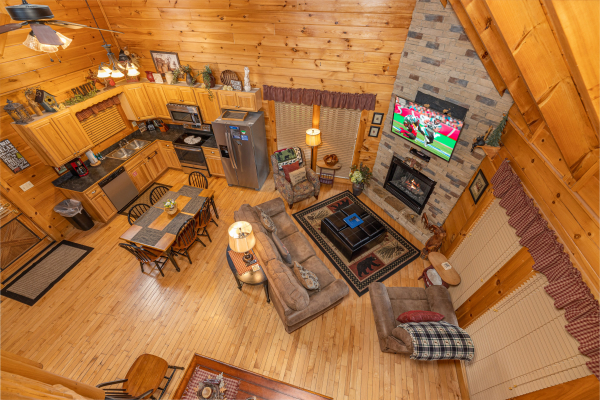 Looking down at the living room at Absolutely Wonderful, a 2 bedroom cabin rental located in Pigeon Forge