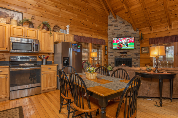 Dining table for six in the kitchen at Absolutely Wonderful, a 2 bedroom cabin rental located in Pigeon Forge
