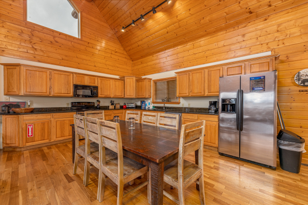 Dining table for 8 at Smoky Mountain Escape, a 3 bedroom cabin rental located in Pigeon Forge