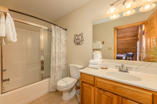 Bathroom with a tub and shower at Smoky Mountain Escape, a 3 bedroom cabin rental located in Pigeon Forge