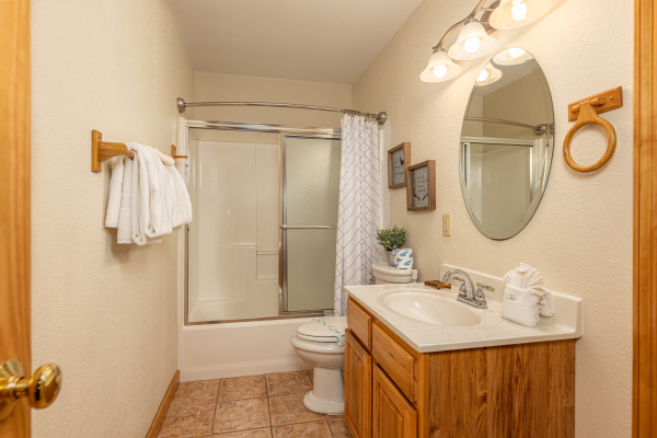Bathroom with a tub and shower at Smoky Mountain Escape, a 3 bedroom cabin rental located in Pigeon Forge