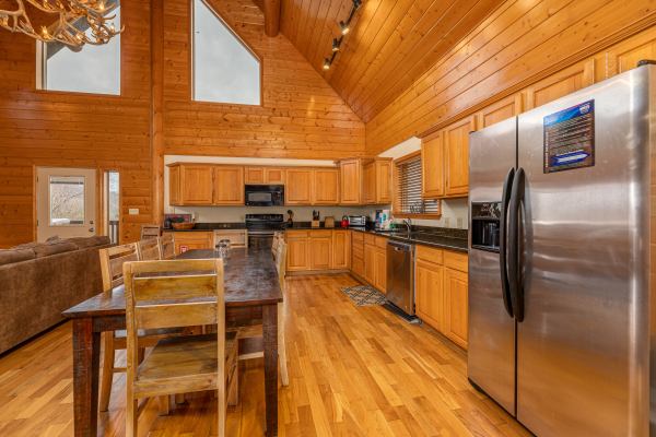 Kitchen and dining at Smoky Mountain Escape, a 3 bedroom cabin rental located in Pigeon Forge