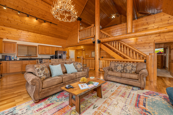 Sofa and loveseat in a living room at Smoky Mountain Escape, a 3 bedroom cabin rental located in Pigeon Forge