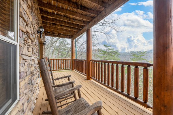 Rocking chairs on the lower deck at Smoky Mountain Escape, a 3 bedroom cabin rental located in Pigeon Forge