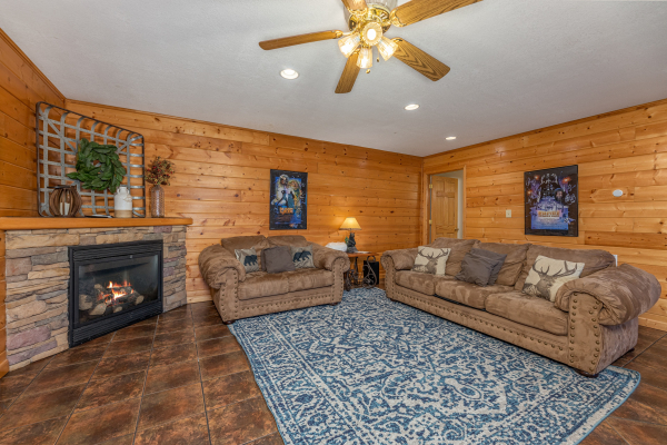 Sofa and loveseat in the lower living room at Smoky Mountain Escape, a 3 bedroom cabin rental located in Pigeon Forge