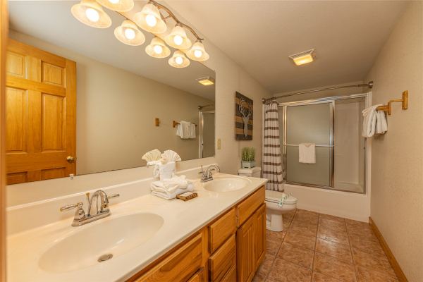 Bathroom with tub and shower at Smoky Mountain Escape, a 3 bedroom cabin rental located in Pigeon Forge