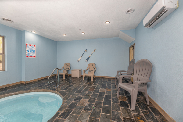 Seating and pool at Everly's Splash, a 4 bedroom cabin rental located in Pigeon Forge
