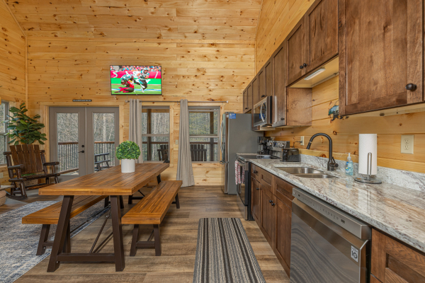 Kitchen with granite counters and stainless appliances at Poolin Around, a 2 bedroom cabin rental located in Gatlinburg