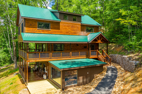 Exterior front view of home and swimming pool at Heavenly Daze, a 4 bedroom cabin rental located in Pigeon Forge