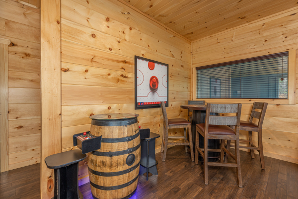 Pub table and arcade in at Heavenly Daze, a 4 bedroom cabin rental located in Pigeon Forge