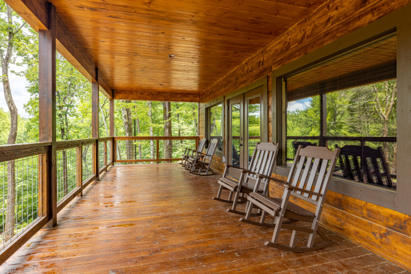 Main floor deck rocking chairs at Heavenly Daze, a 4 bedroom cabin rental located in Pigeon Forge