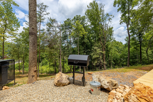 Outdoor charcoal grill at Heavenly Daze, a 4 bedroom cabin rental located in Pigeon Forge