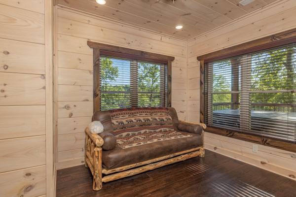 Futon in a bedroom at Smoky Mountain Chalet, a 3 bedroom cabin rental located in Pigeon Forge