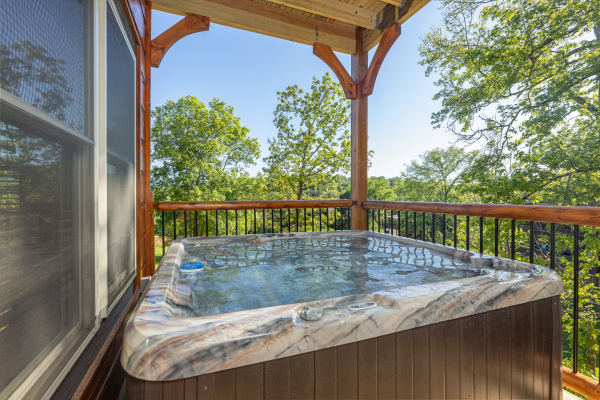 Hot tub on the deck at Smoky Mountain Chalet, a 3 bedroom cabin rental located in Pigeon Forge