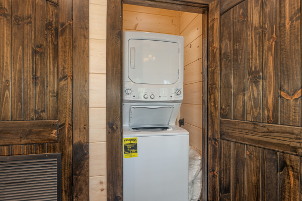 Stacked washer and dryer at Smoky Mountain Chalet, a 3 bedroom cabin rental located in Pigeon Forge