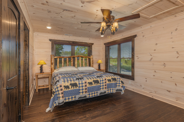 bedroom with log bed, night stands, and lamps at Smoky Mountain Chalet, a 3 bedroom cabin rental located in Pigeon Forge