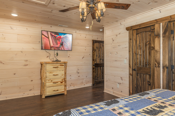 Dresser and TV in a bedroom at Smoky Mountain Chalet, a 3 bedroom cabin rental located in Pigeon Forge
