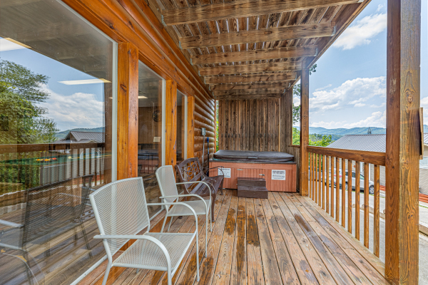Hot tub and deck seating at High In The Smokies, a 2 bedroom cabin rental located in Gatlinburg
