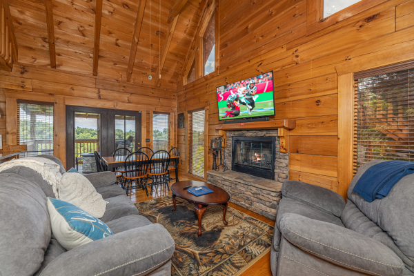 Living room amenities and deck view  at Smokies Serenity, a 2 bedroom cabin rental located in Douglas Lake