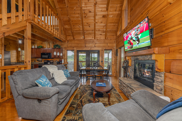 Living room seating, T.V., and fireplace at Smokies Serenity, a 2 bedroom cabin rental located in Douglas Lake