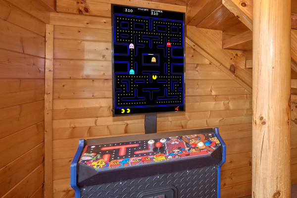 Arcade in game room at Million Dollar View, a 2 bedroom cabin rental located in Pigeon Forge