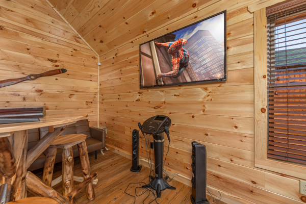 Arcade game and flat screen at The One With The View, a 4 bedroom cabin rental located in Pigeon Forge