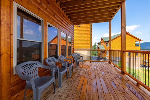 Back deck seating at The One With The View, a 4 bedroom cabin rental located in Pigeon Forge