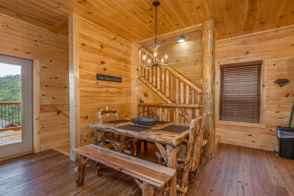 Log dining table at The One With The View, a 4 bedroom cabin rental located in Pigeon Forge