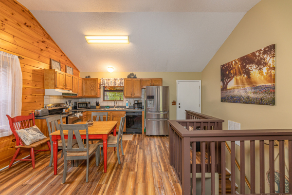 Kitchen with dining table at Copper Owl, a 2 bedroom cabin rental located in Pigeon Forge
