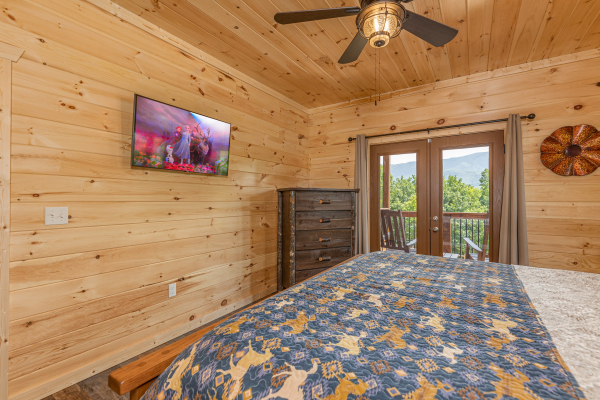 Bedroom TV and dresser at Twin Peaks, a 5 bedroom cabin rental located in Gatlinburg