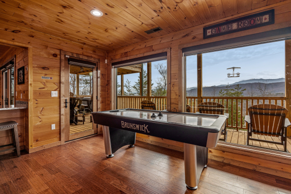 Air hockey table at Four Seasons Grand, a 5 bedroom cabin rental located in Pigeon Forge