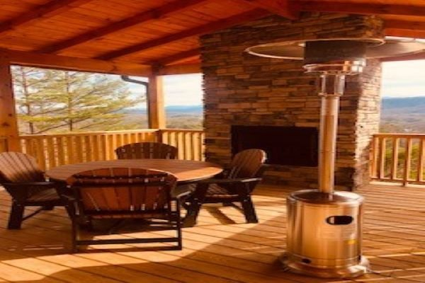 Fireplace and outdoor heater at Four Seasons Grand, a 5 bedroom cabin rental located in Pigeon Forge