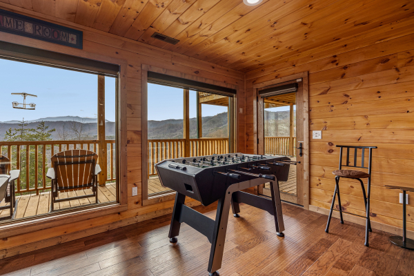 Foosball table at Four Seasons Grand, a 5 bedroom cabin rental located in Pigeon Forge