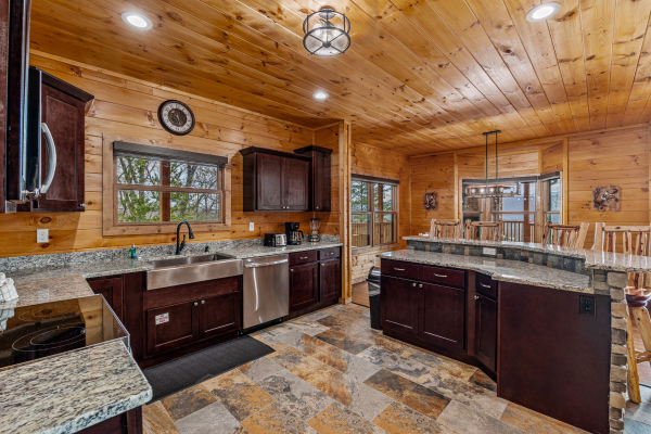Kitchen appliances and granite counters at Four Seasons Grand, a 5 bedroom cabin rental located in Pigeon Forge