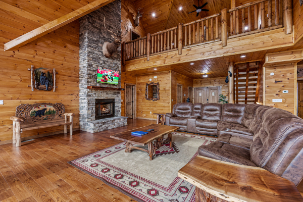 Living room with vaulted ceiling at Four Seasons Grand, a 5 bedroom cabin rental located in Pigeon Forge