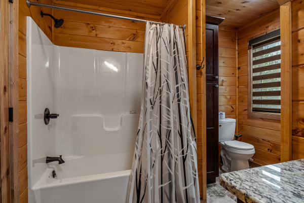 Loft bathroom with bathroom and shower combo at Four Seasons Grand, a 5 bedroom cabin rental located in Pigeon Forge