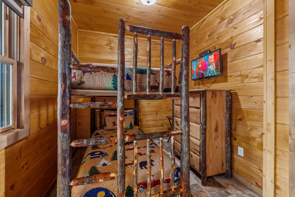 Log bunkbeds at Four Seasons Grand, a 5 bedroom cabin rental located in Pigeon Forge