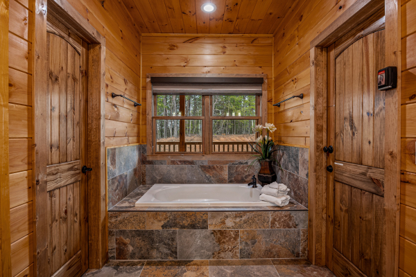 Master bathroom bathtub at Four Seasons Grand, a 5 bedroom cabin rental located in Pigeon Forge