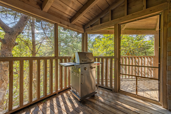 Grill on screened-in porch at old glory, a 2 bedroom cabin rental located in Pigeon Forge