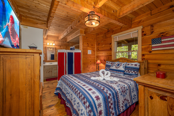 Master bedroom at old glory, a 2 bedroom cabin rental located in Pigeon Forge
