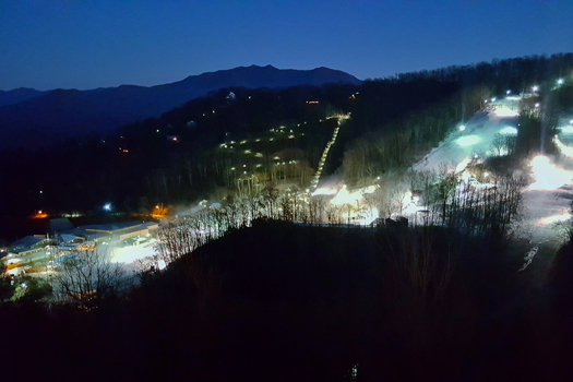 Ober Mountain at night near A Getaway Chalet, a 2 bedroom cabin rental located in Gatlinburg