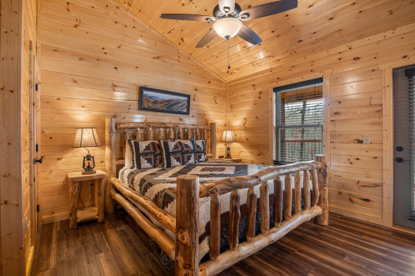 Bedroom with log furniture at Cool Pool Lodge