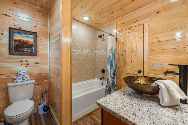 Bathroom with shower tub combo at Cool Pool Lodge
